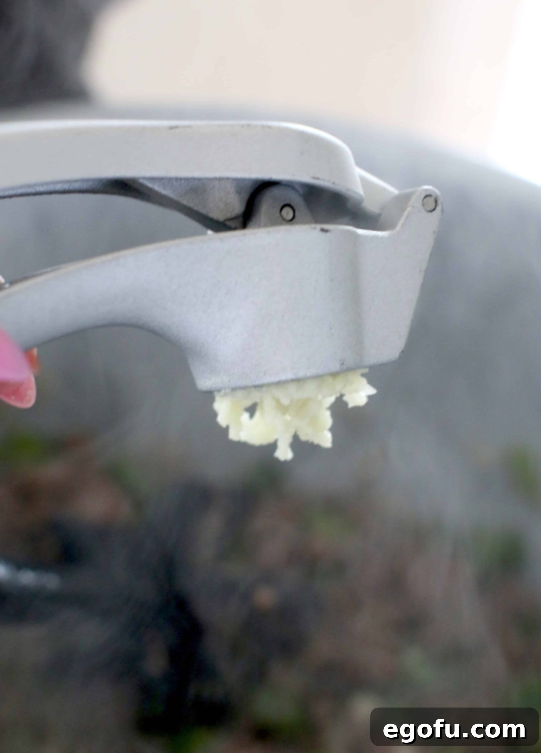 Hearty Instant Pot American Goulash 7 Close-up shot of freshly minced garlic cloves, highlighting their texture and readiness to be added to the Instant Pot Goulash recipe for maximum flavor.