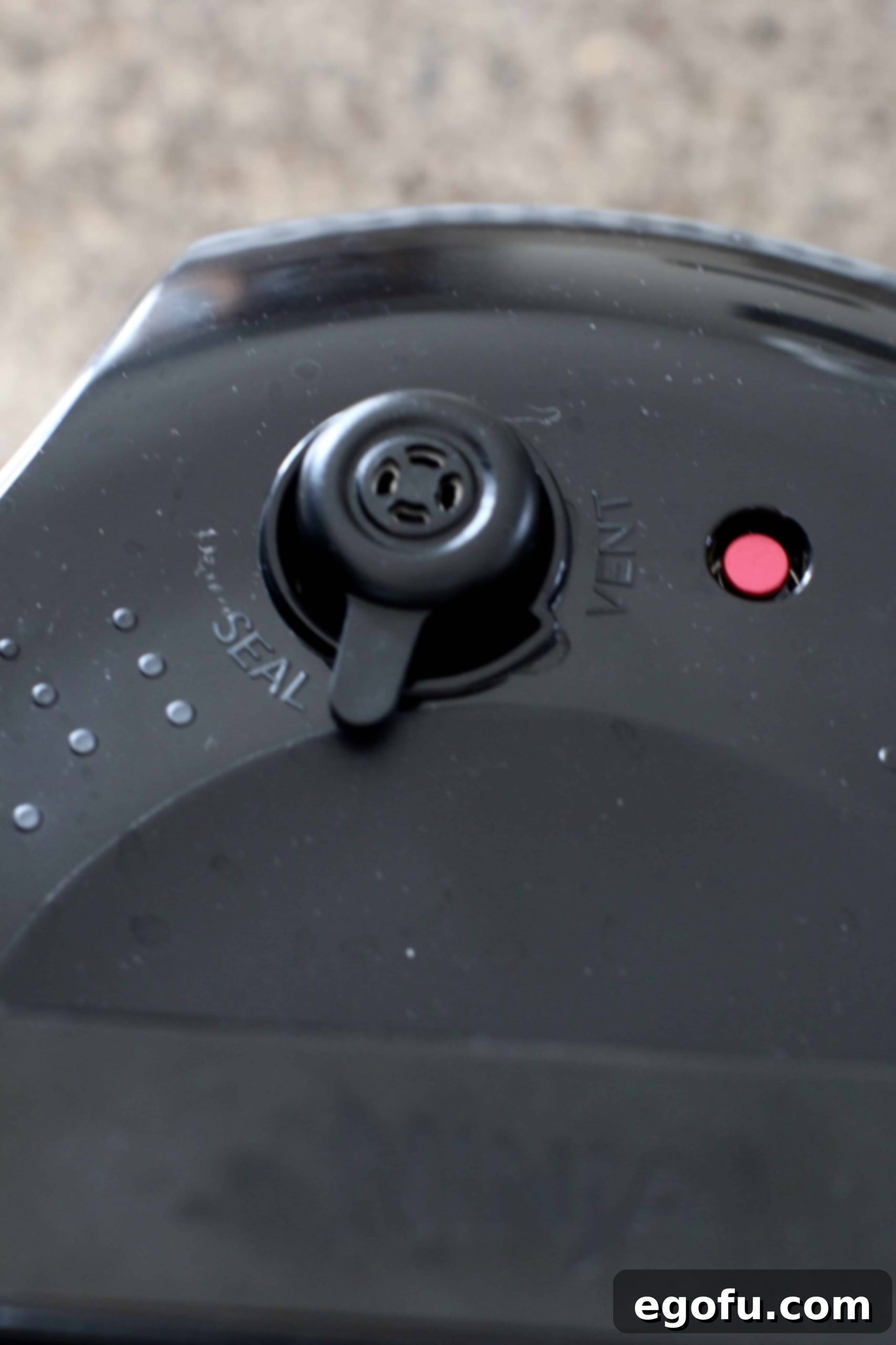 Hearty Instant Pot American Goulash 9 Close-up of an Instant Pot electric pressure cooker lid, showing the pressure release valve set to the "Sealing" position, indicating readiness for cooking.