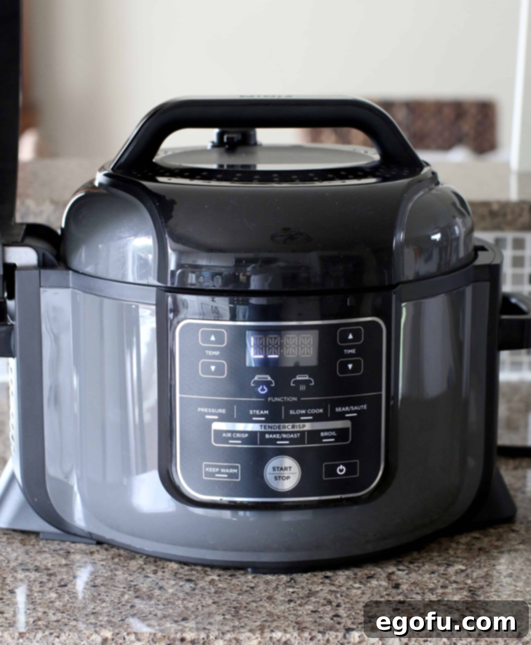 Hearty Instant Pot American Goulash 10 A Ninja Foodi XL pressure cooker displaying a digital timer or setting, ready after a quick pressure release, with the pressure valve in the venting position.