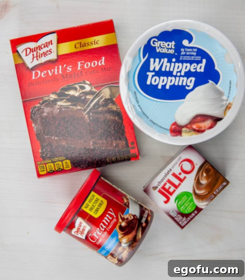 chocolate cake mix, whipped topping, cold milk, instant chocolate pudding, milk chocolate frosting.