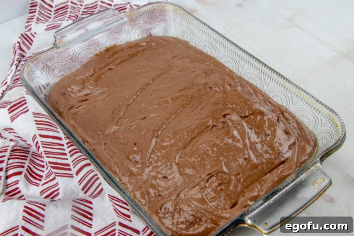 chocolate pudding poured over chocolate cake.
