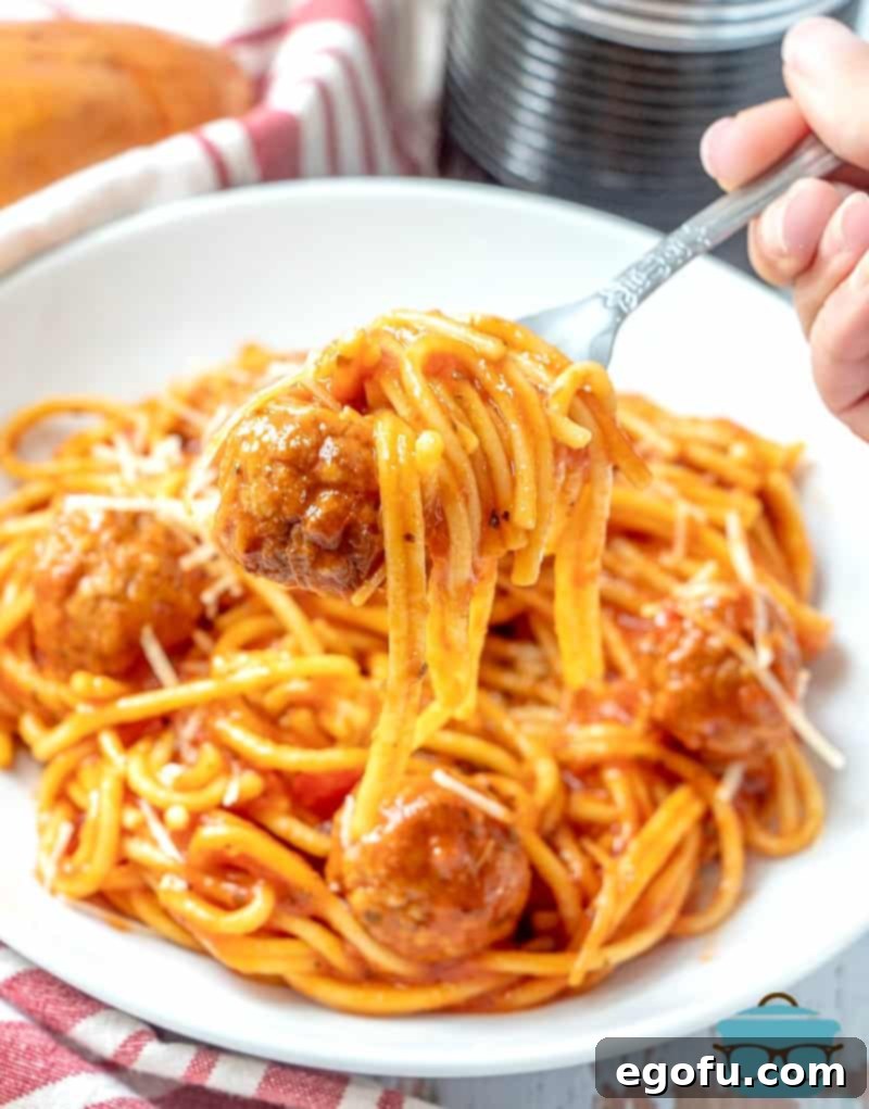 One-Pot Wonder: Instant Pot Spaghetti & Meatballs 8 finished Instant Pot Spaghetti and Meatballs swirled around fork.