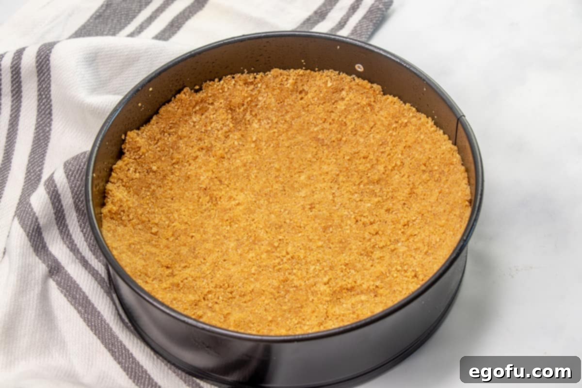 The Ultimate Instant Pot Cheesecake 6 graham cracker crust pressed into the bottom of a 7-inch springform pan.