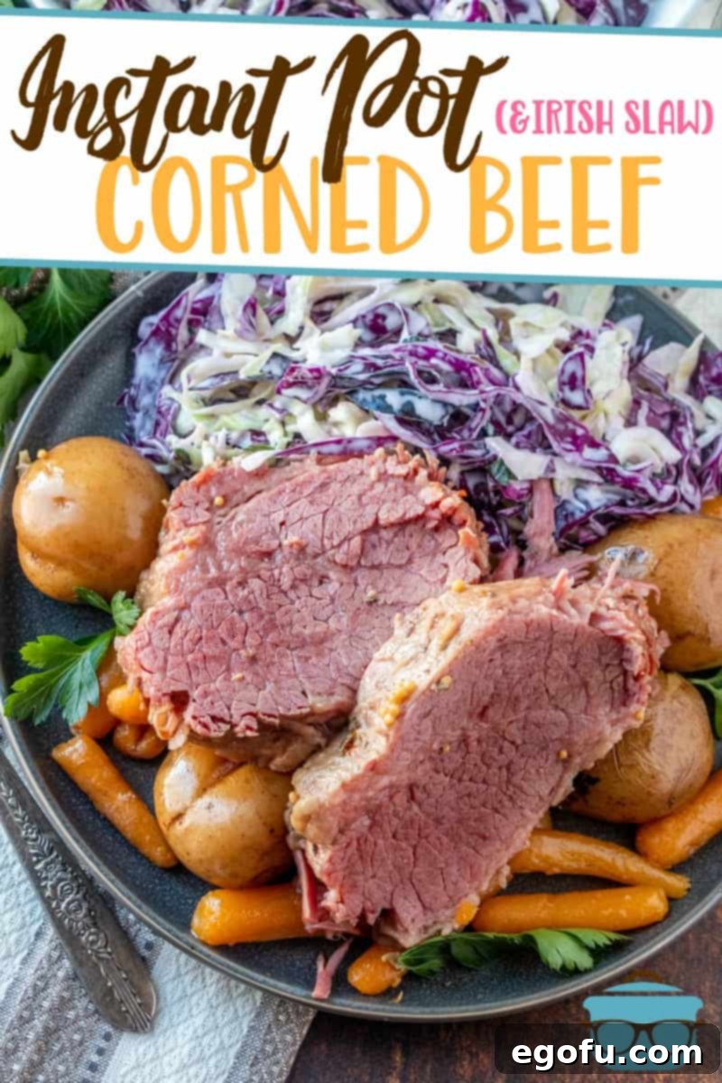 Instant Pot Corned Beef, potatoes, carrots and Irish Cole Slaw shown on a light blue plate.