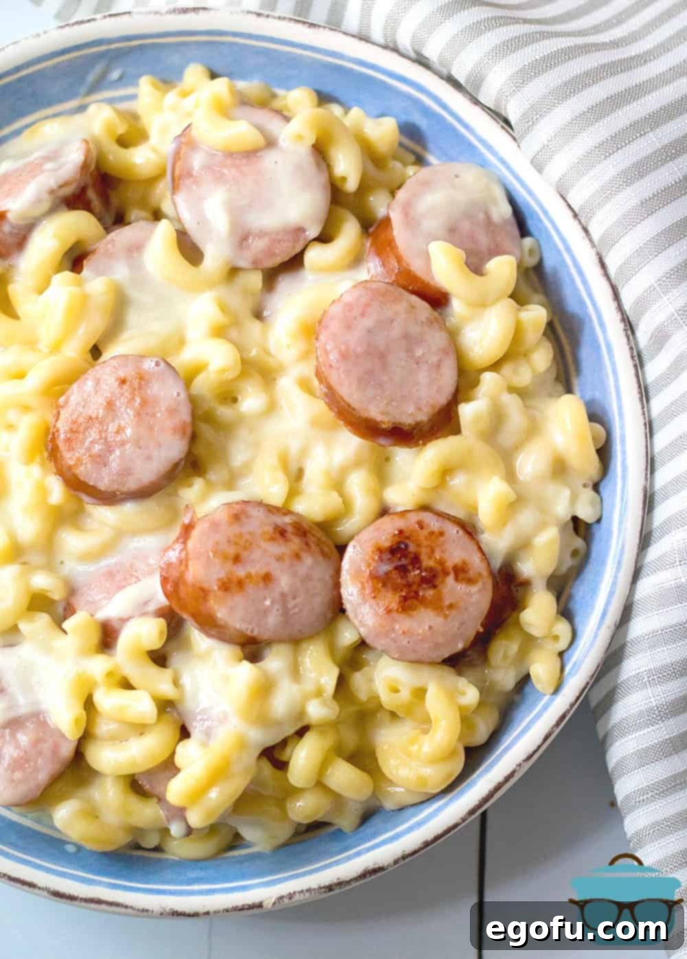 Creamy Instant Pot Sausage Mac and Cheese 2 Instant Pot Sausage White Cheddar Macaroni and Cheese served in a bowl, showcasing its rich, creamy texture and generous pieces of sausage.