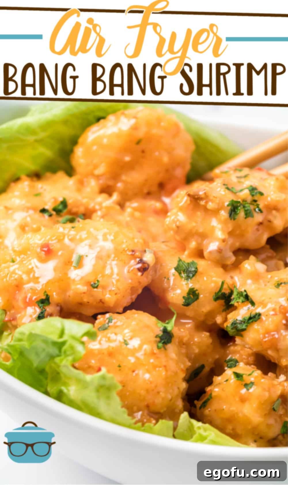 Beautifully prepared Air Fryer Bang Bang Shrimp recipe from The Country Cook, artfully arranged on a fresh lettuce leaf in a pristine white bowl.