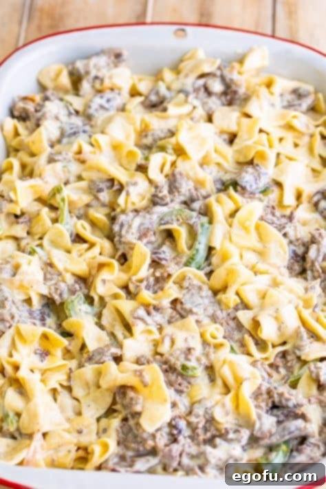 Unbaked cheesesteak casserole in a dish.