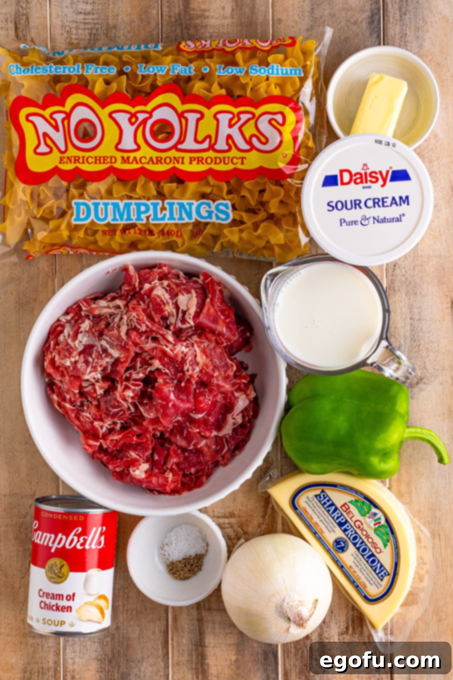 Egg noodles, preshaved ribeye steak, green peppers, onion, sour cream, cream of chicken soup, salt, pepper, and butter.