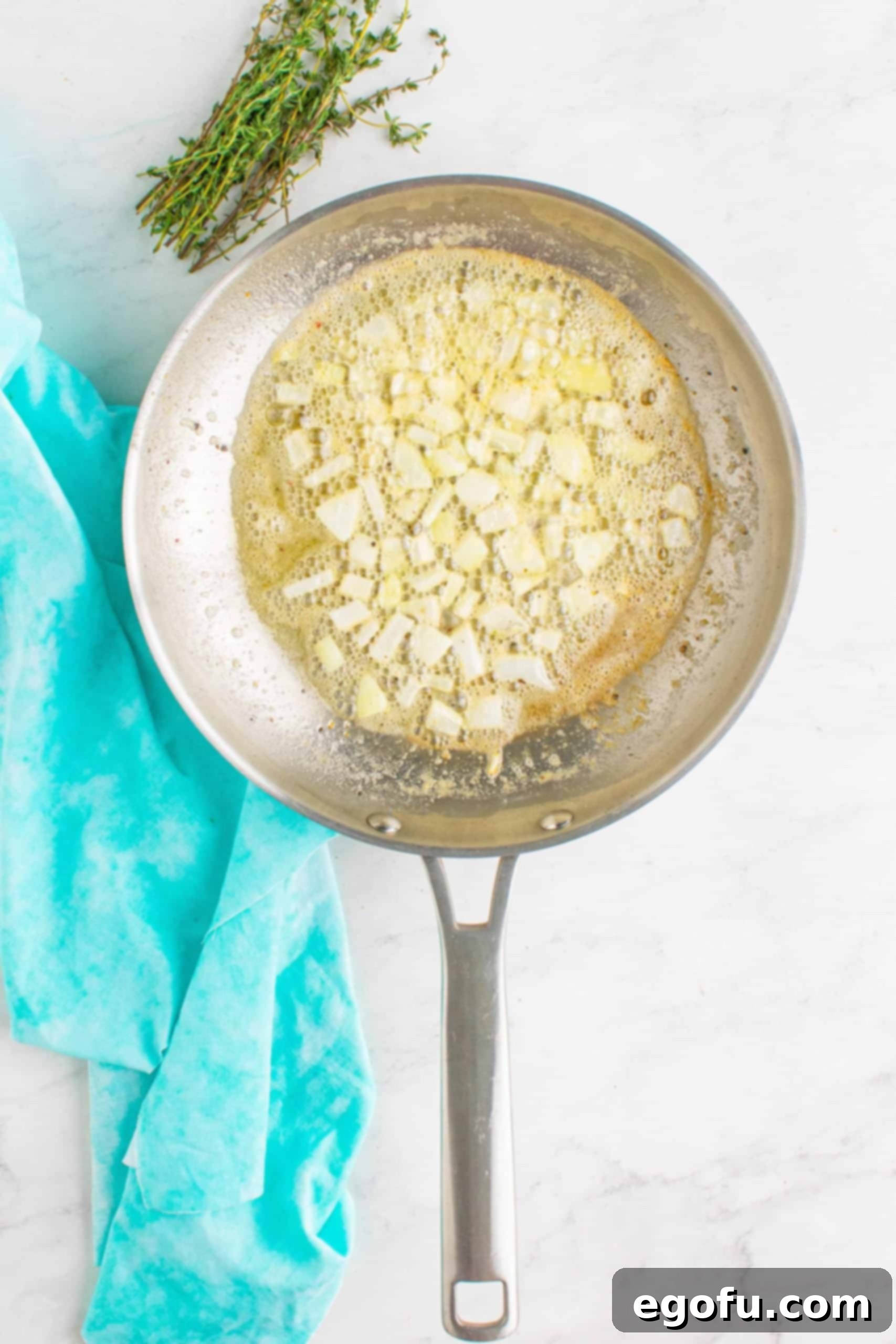 diced onions added to butter in a medium-sized steel skillet.