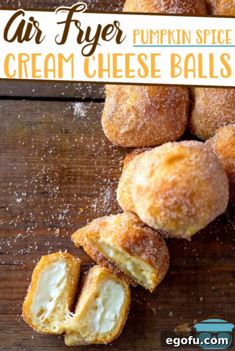 Air Fryer Pumpkin Spice Cream Cheese Bites recipe from The Country Cook, bites shown on a wooden surface with one cream cheese bite opened to show the middle.