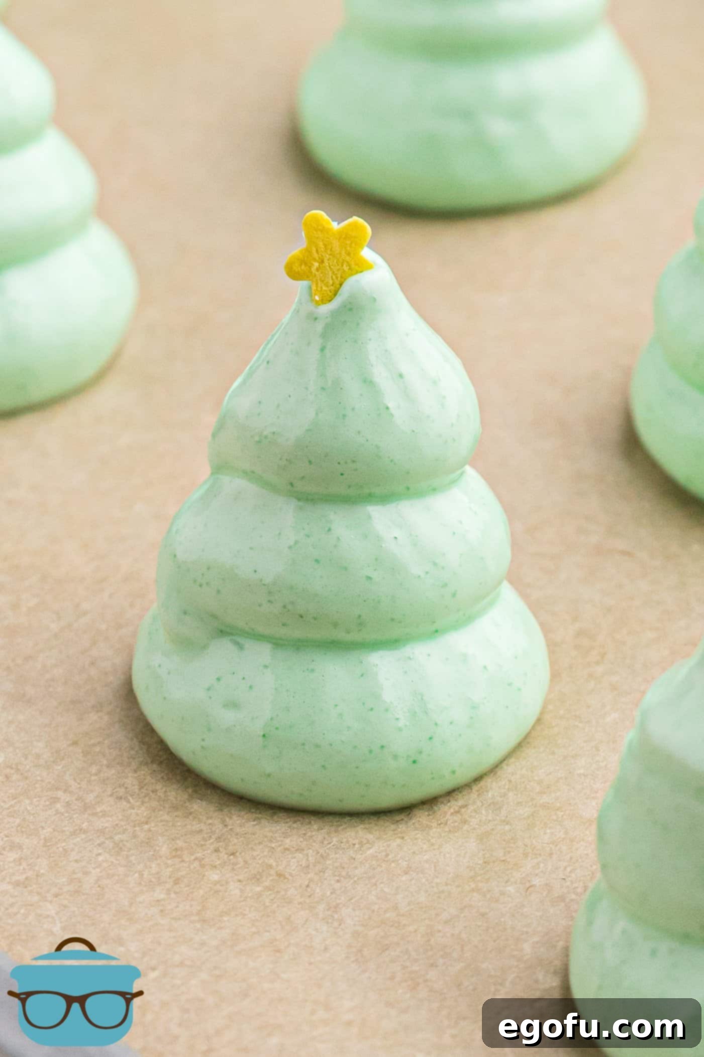 meringue piped into a tree shape with a candy star on top.