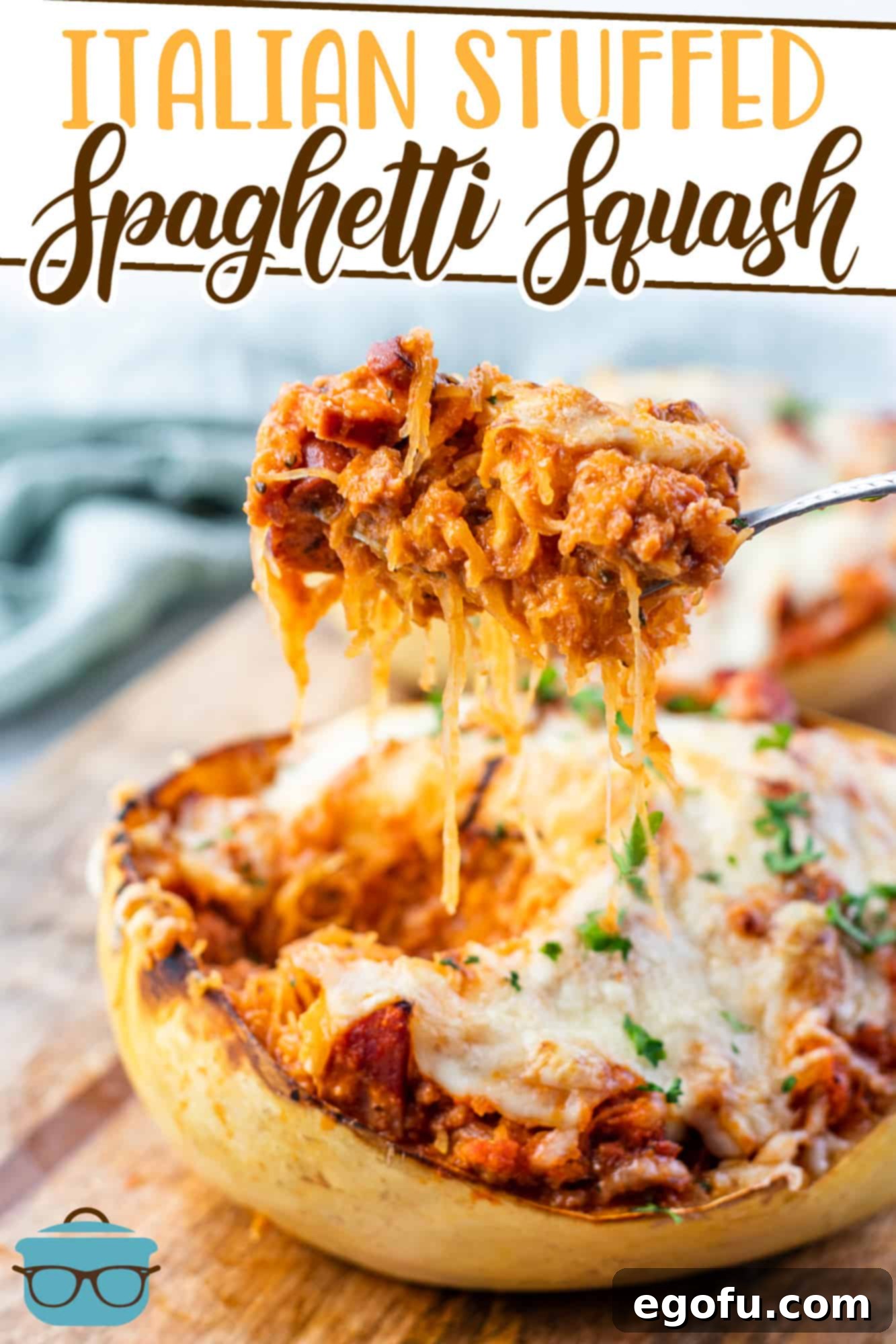 Italian Stuffed Spaghetti Squash recipe from The Country Cook, shown with a spoon scooping out some of the squash filling, highlighting its texture and rich ingredients