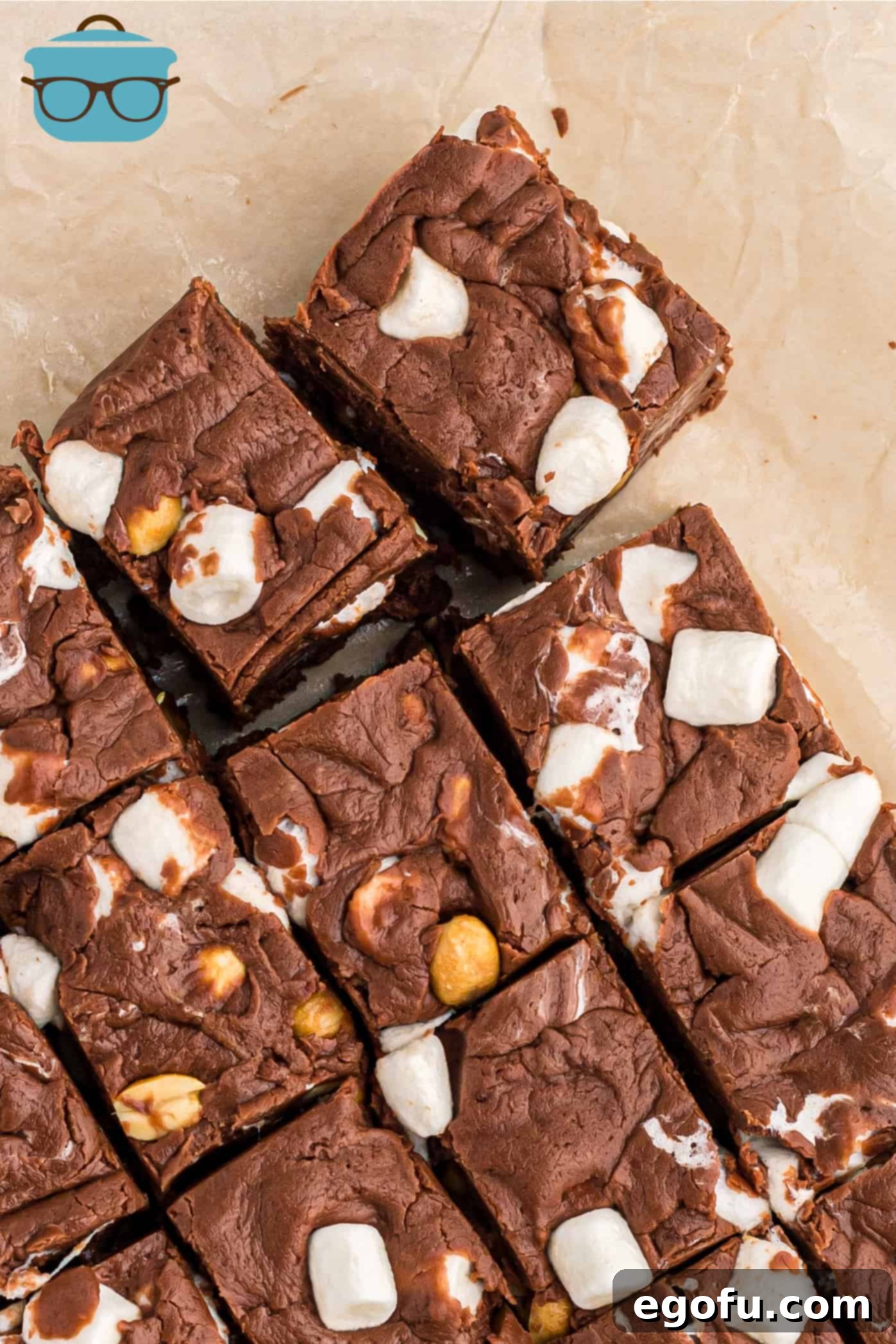 Bumpy Road Bliss 2 Homemade Rocky Road Fudge, cut into neat squares and displayed on natural parchment paper.