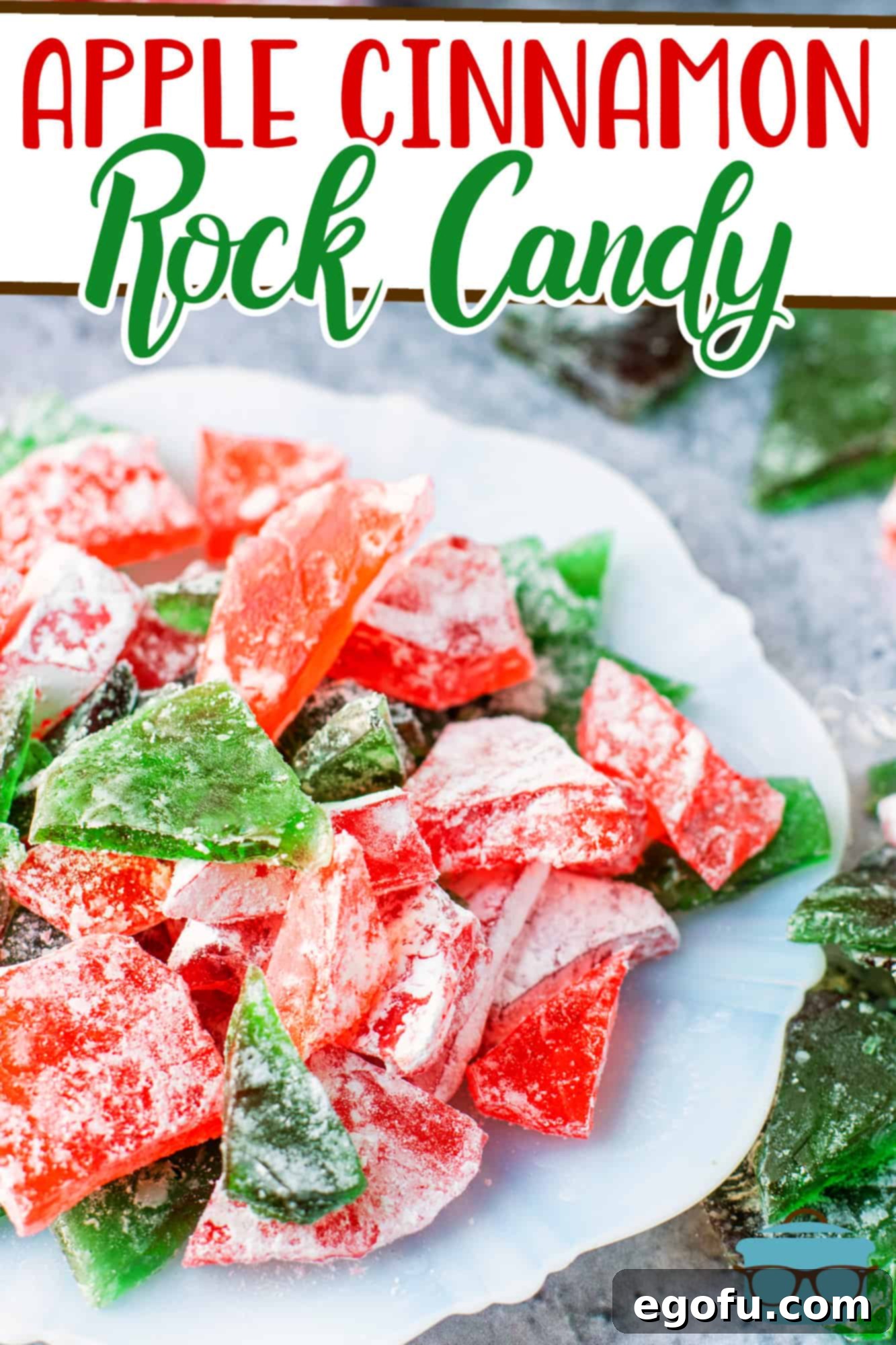 Vibrantly colored red and green Apple Cinnamon Rock Candy pieces elegantly arranged on a clean white plate, showcasing their crystalline texture.