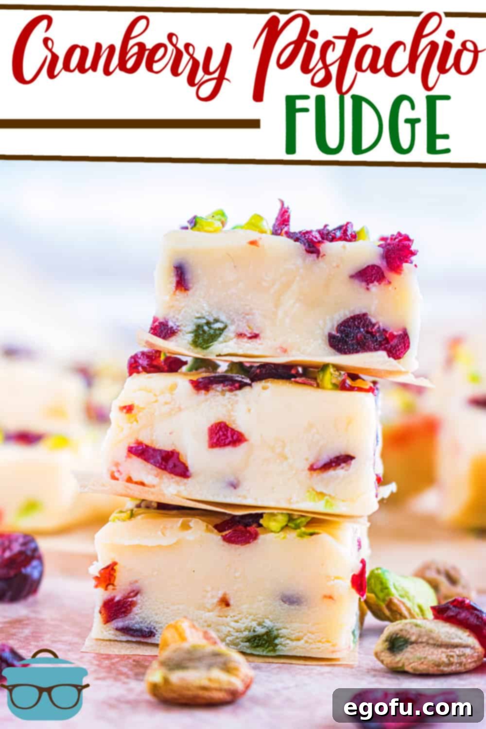Luscious White Chocolate Cranberry Fudge 2 Three slices of homemade White Chocolate Cranberry Pistachio Fudge showcasing its rich texture and festive toppings, ready to be enjoyed.