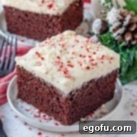 Winter Wonderland Chocolate Peppermint Cake 2 Homemade Chocolate Peppermint Cake, slice of cake shown on a small white round plate with christmas decor the background