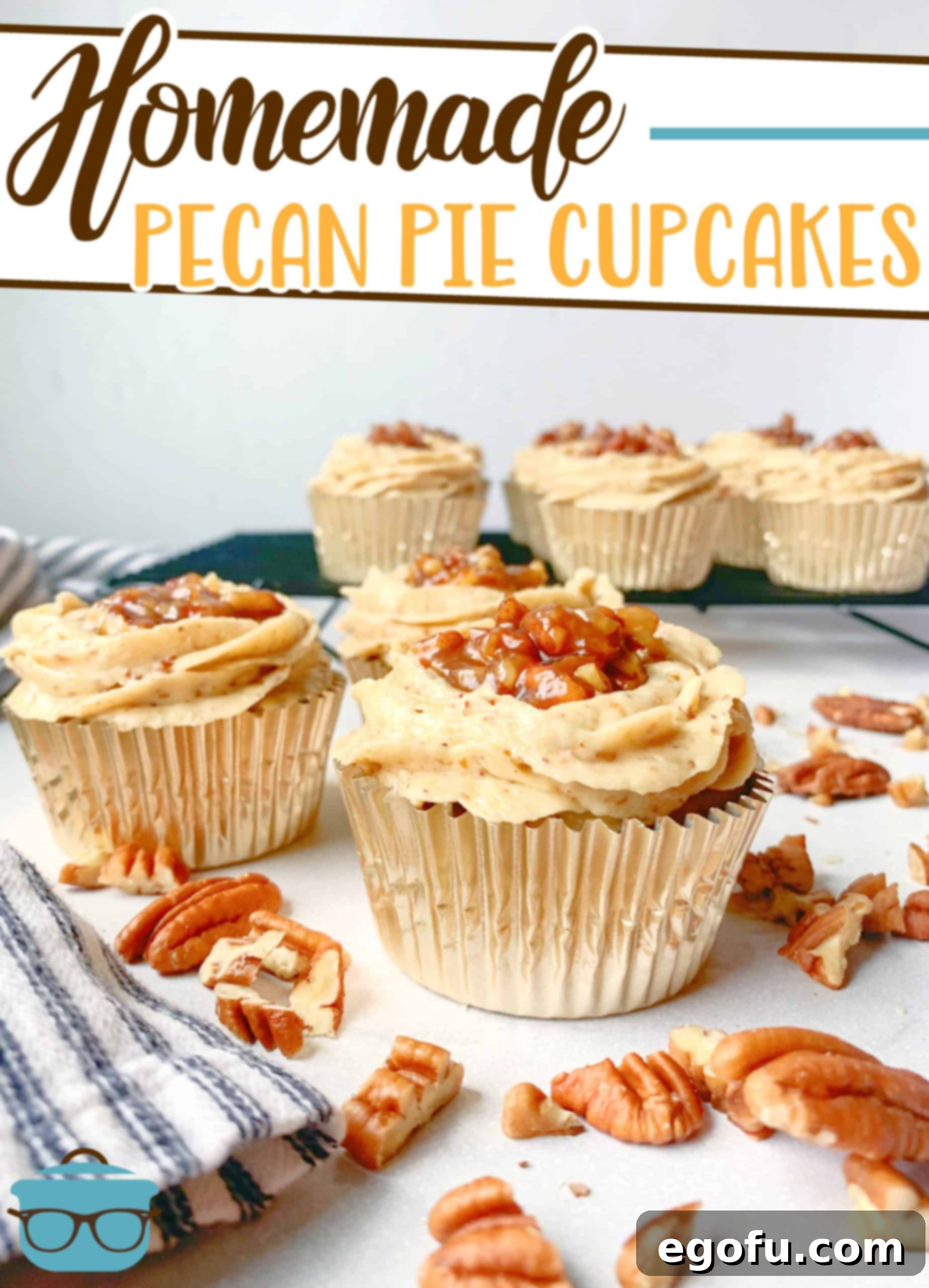 Homemade Pecan Pie Cupcakes presented on an elegant marble surface, with loose pecans artfully scattered around for a rustic touch.