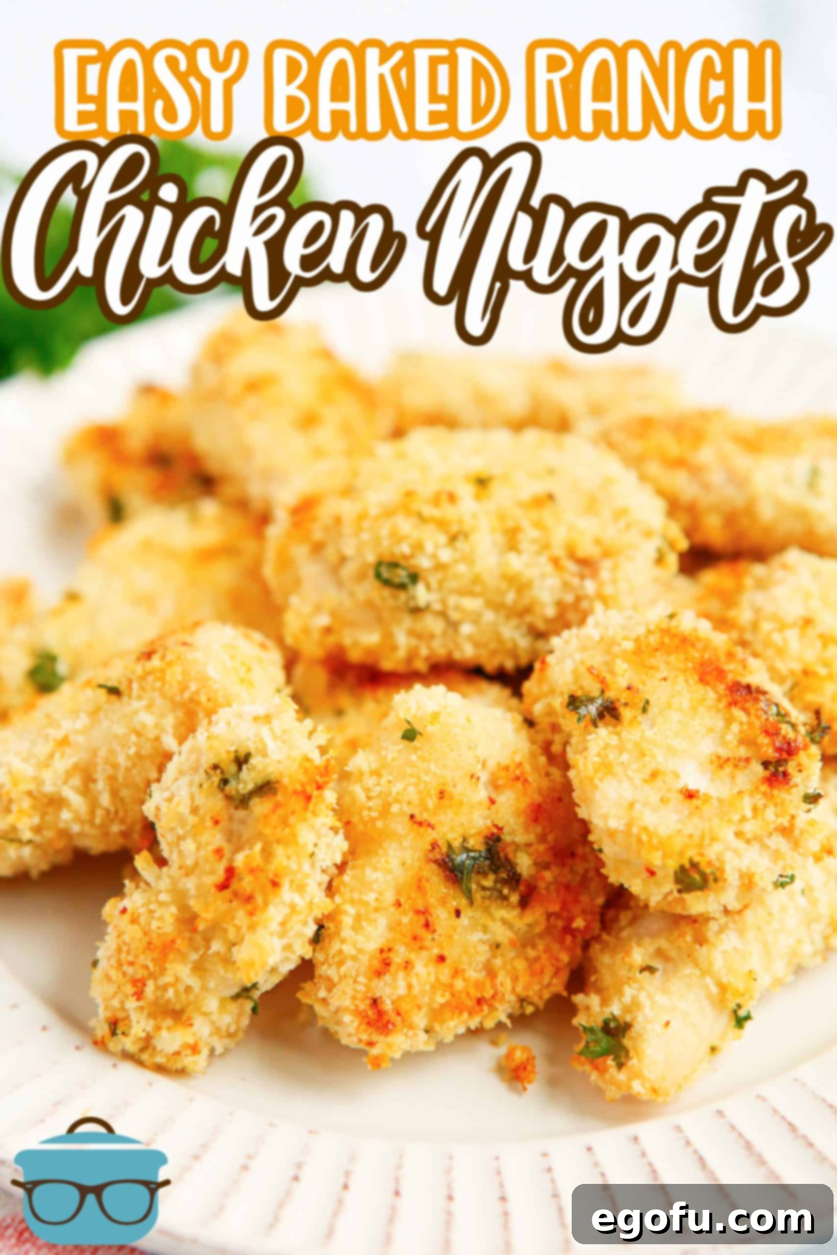 Side view of stacked Chicken Nuggets on a round white plate, ready to be served.