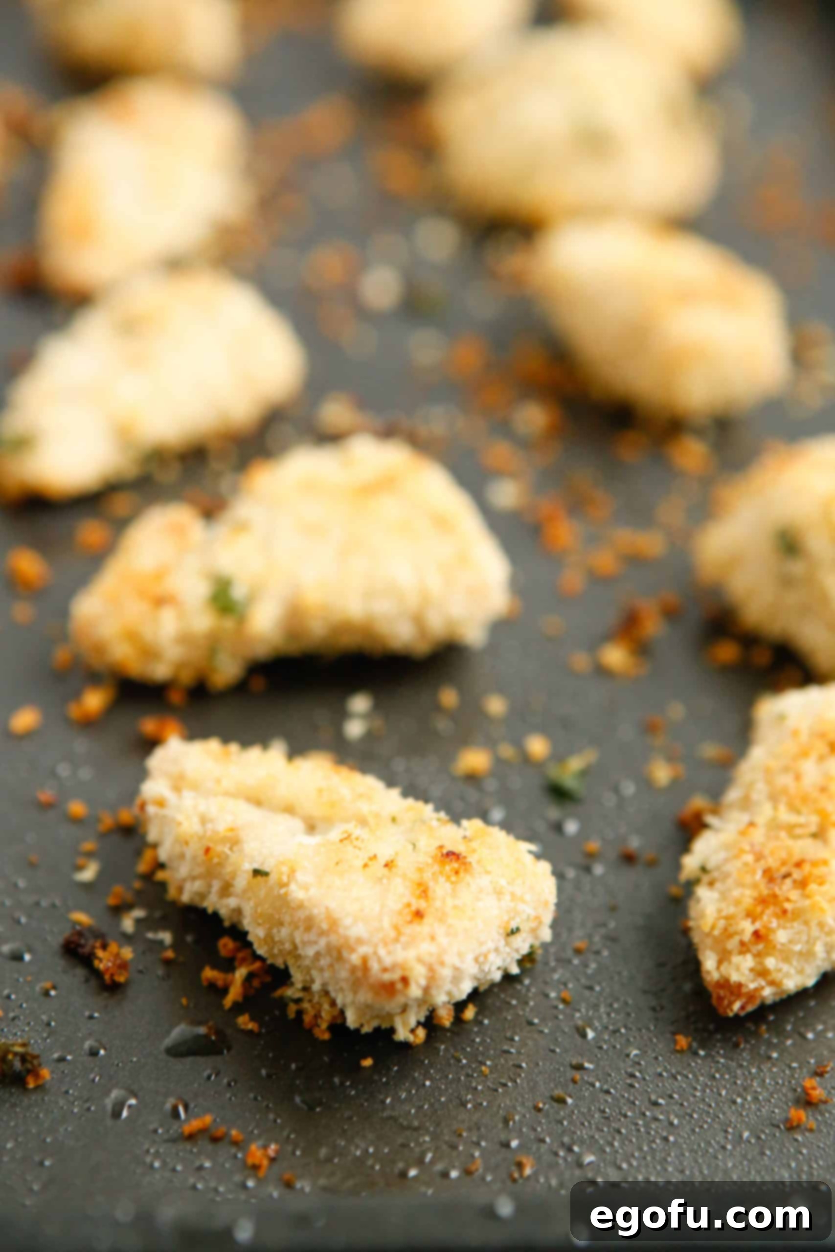 Fully Baked Ranch Chicken Nuggets on baking pan, golden and crispy.