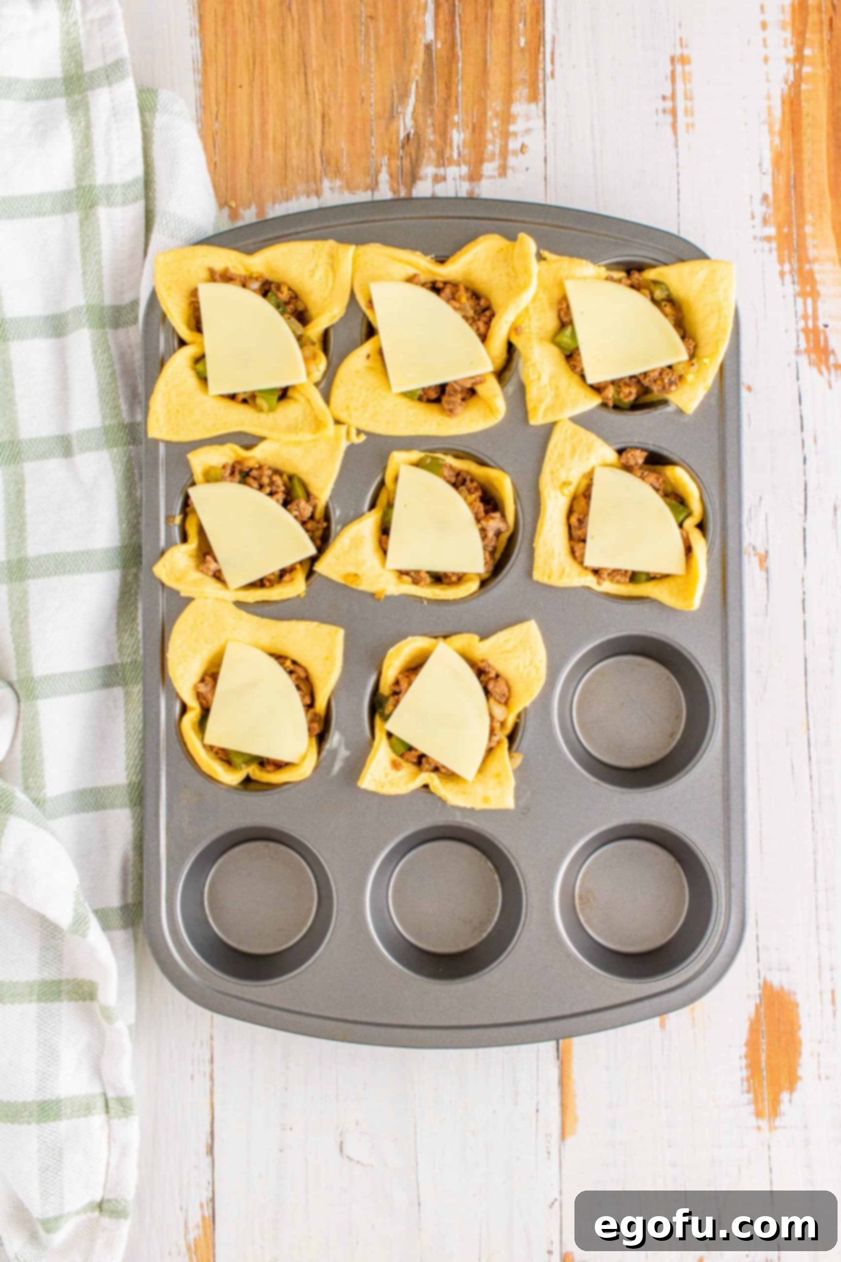 Philly Cheesesteak Poppers 10 Additional cheese slices placed over the beef mixture.