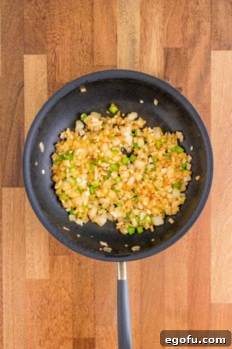 Creamy Crock Pot White Chicken Chili 14 chopped onions and celery in a skillet.