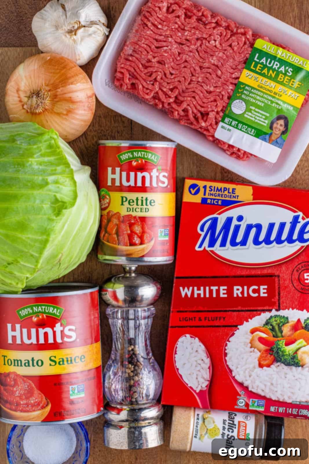 A vibrant collage of key ingredients for Crock Pot Unstuffed Cabbage Rolls: ground beef, Minute Rice, petite diced tomatoes, tomato sauce, and fresh cabbage, onion, and garlic.