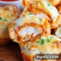 Close up of stacked chicken parmesan cups with a bite taken out of one thumbnail image
