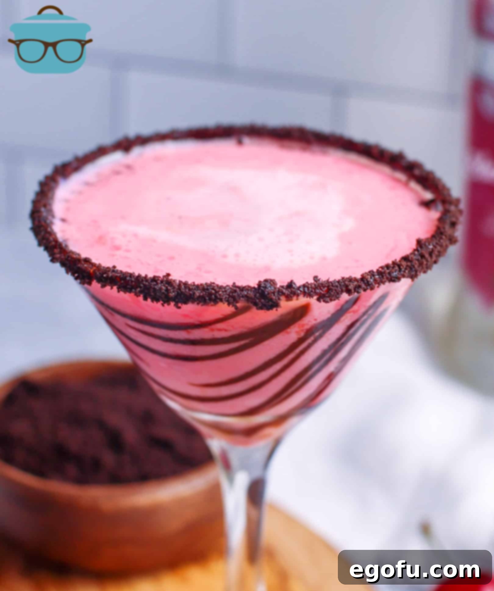 Cherry Garcia Martini in glass with rim topped with crushed Oreo cookies, evoking a dessert-like cocktail.