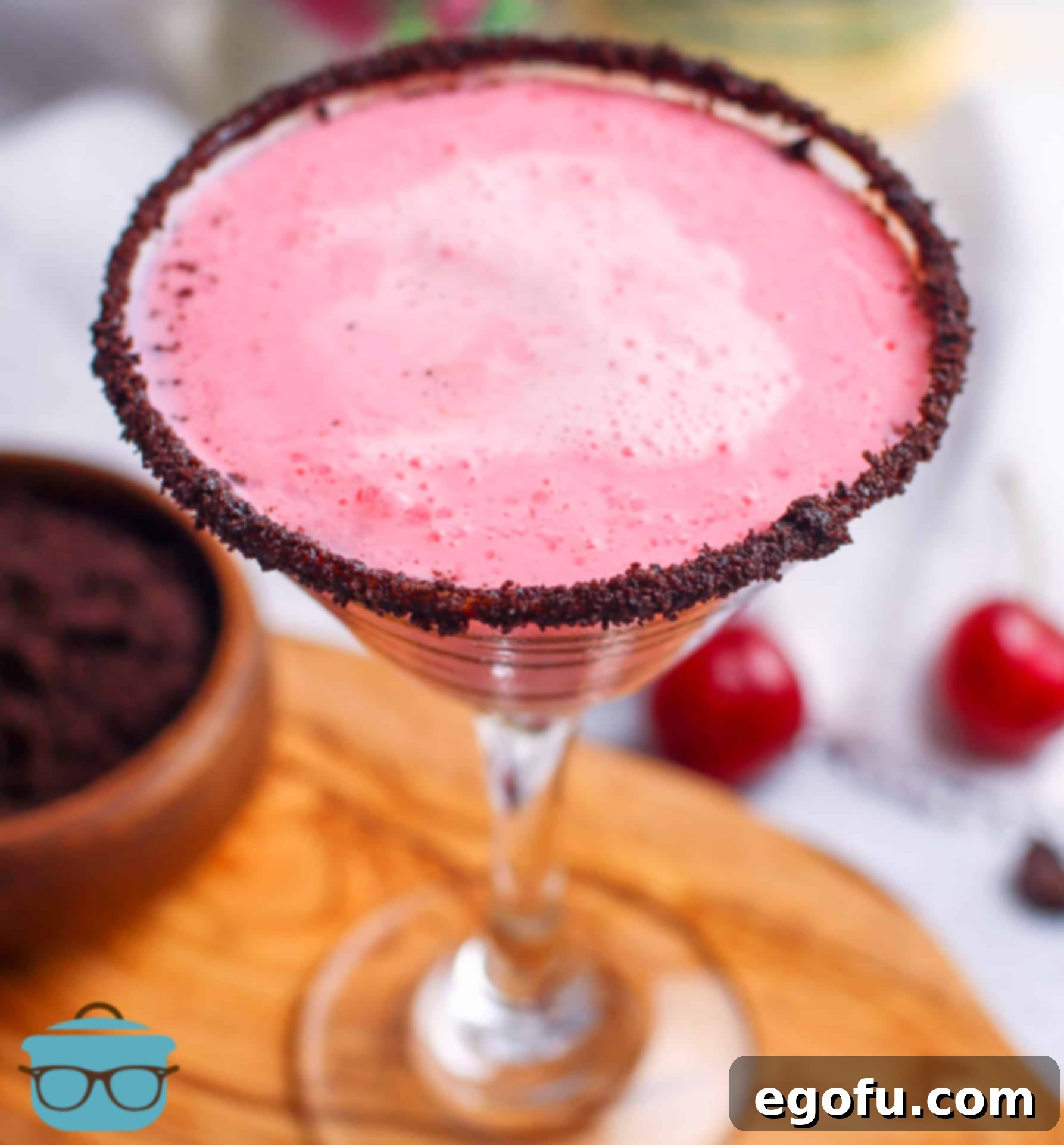 An overhead view of a finished Cherry Garcia Martini, showing the rich color of the drink and the inviting chocolate-cookie rim.