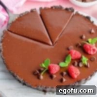 Decadent Raspberry Chocolate Tart 12 Raspberry Chocolate Tart thumbnail image with two slices cut