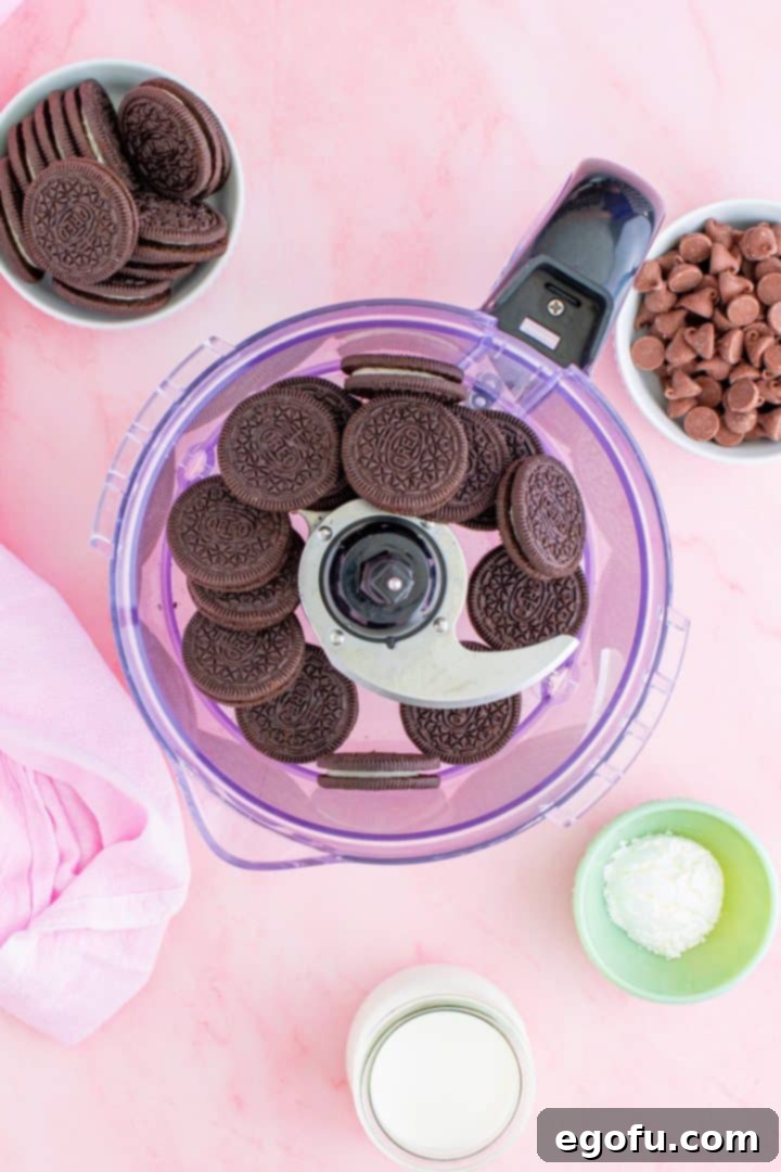 Decadent Raspberry Chocolate Tart 5 Oreo cookies being processed into fine crumbs in a food processor.