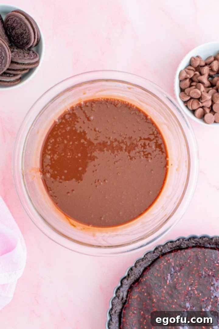 Decadent Raspberry Chocolate Tart 9 Melted chocolate and cream stirred together to form a smooth ganache.