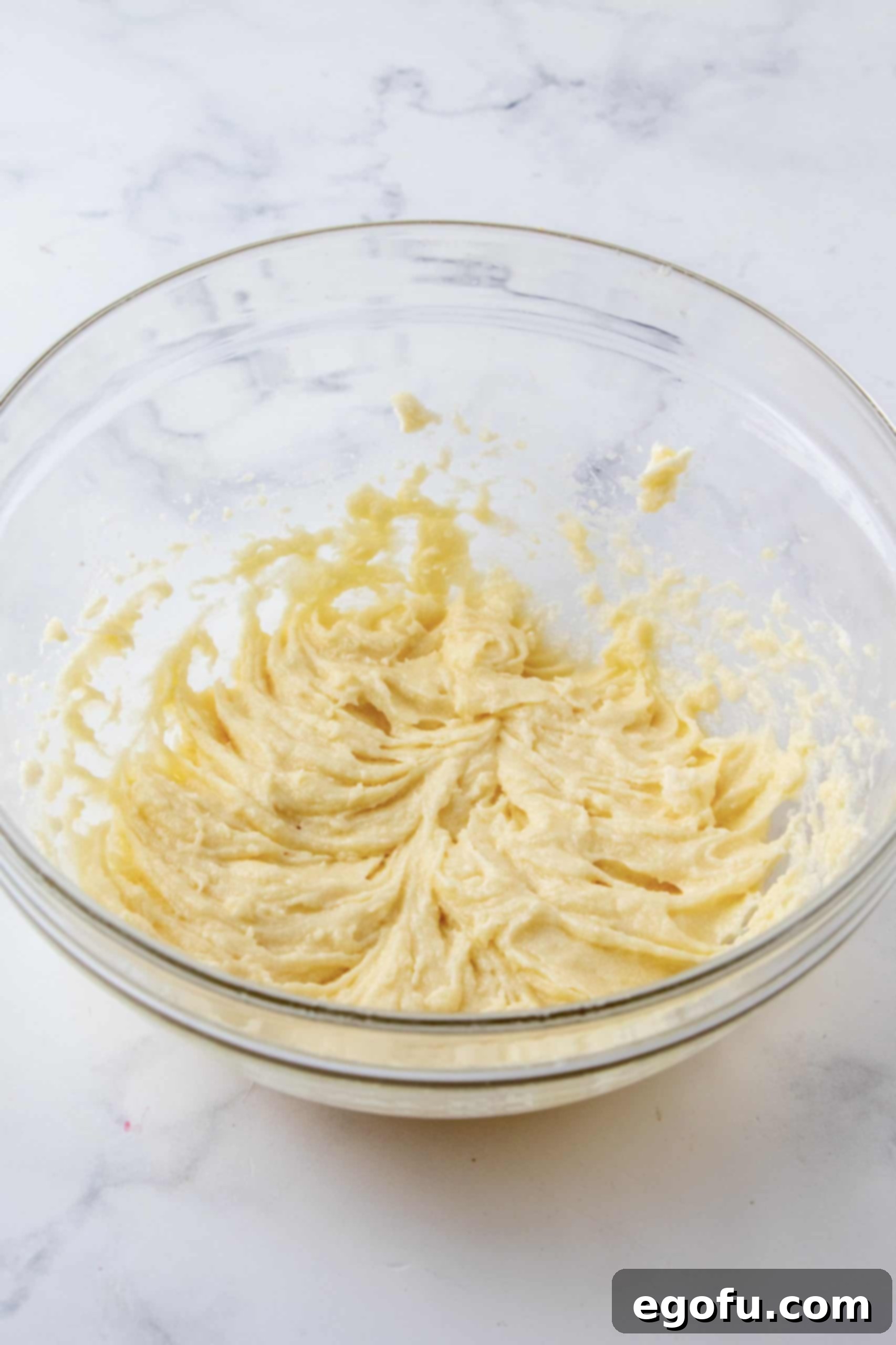 Crimson Raspberry Flip Cake 12 Beaten up butter sugar mixture in bowl.