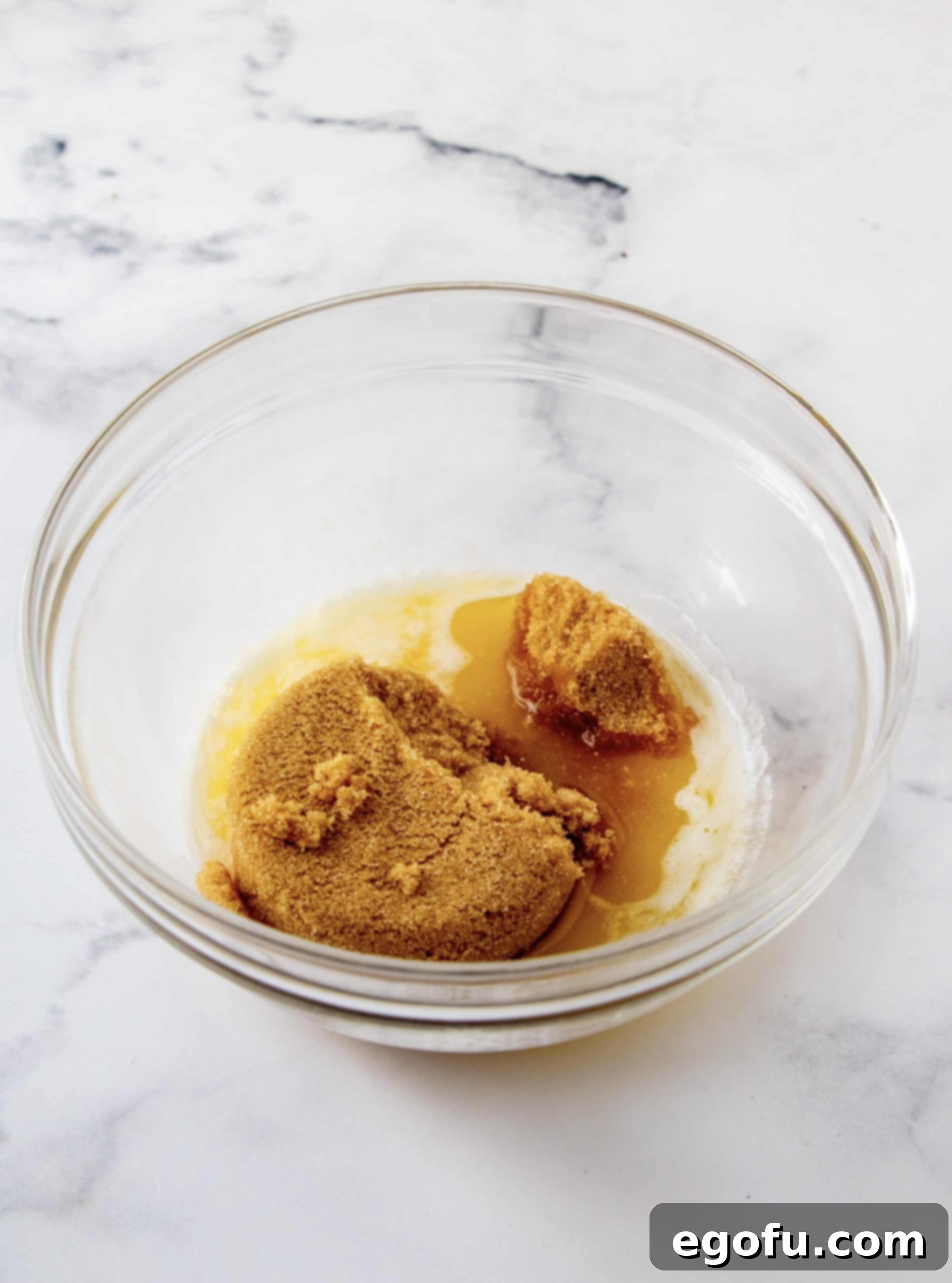 Crimson Raspberry Flip Cake 5 Brown sugar added to melted butter in bowl.