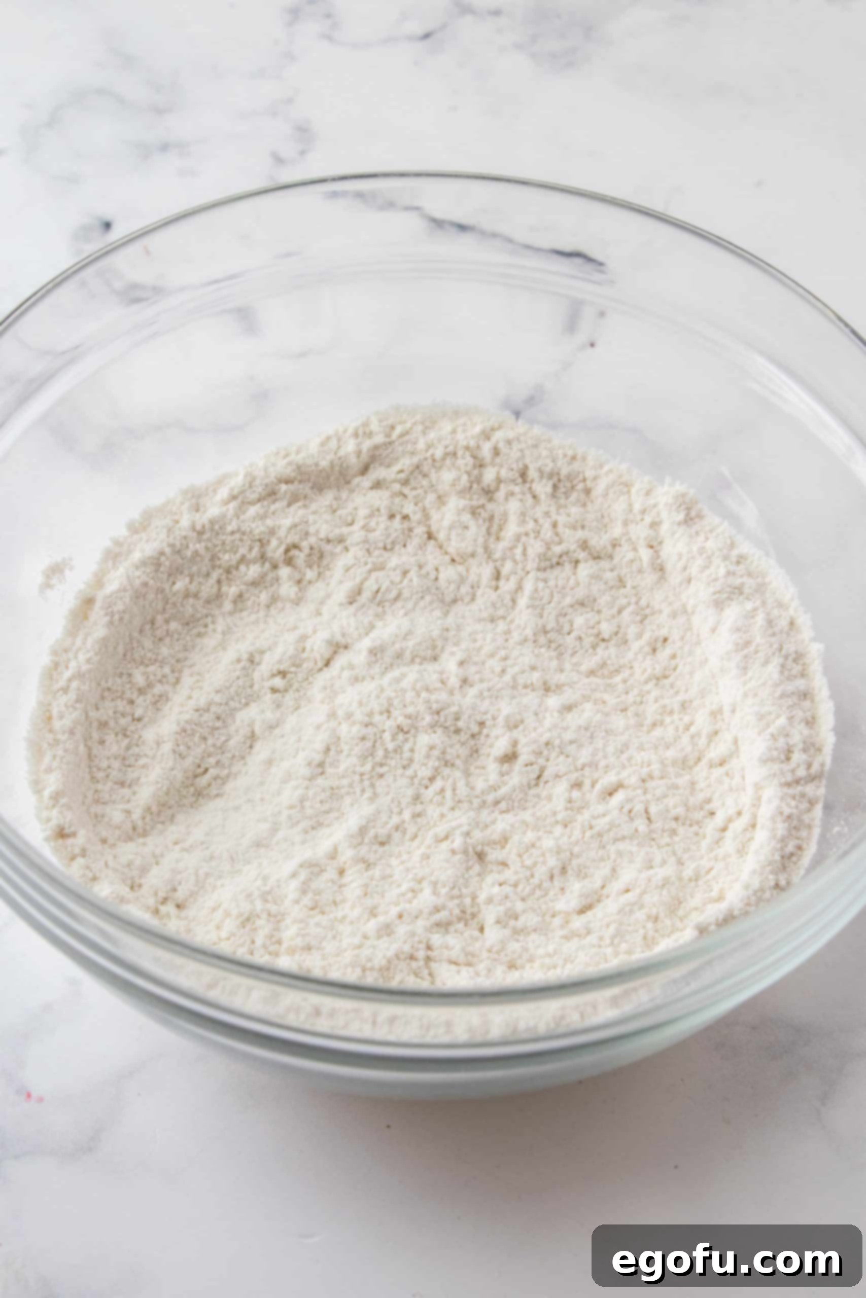 Crimson Raspberry Flip Cake 10 Flour mixture whisked together in bowl.