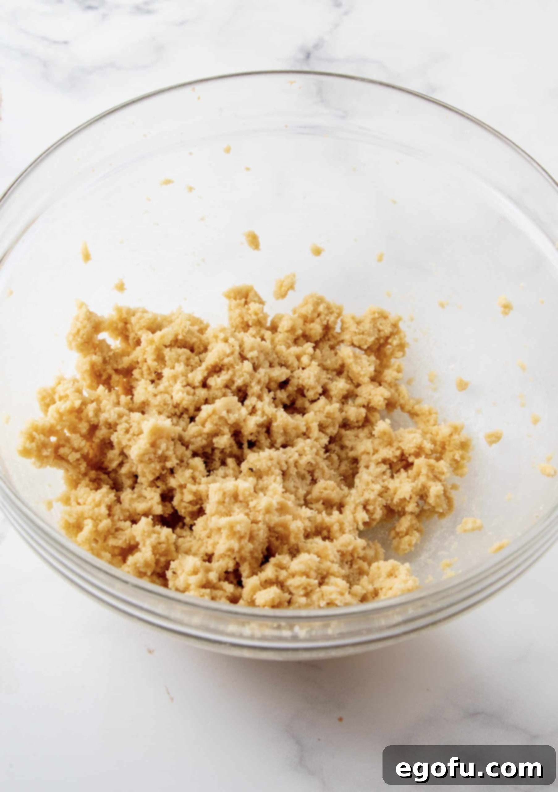 Butters and sugar beaten until fluffy in a clear mixing bowl.