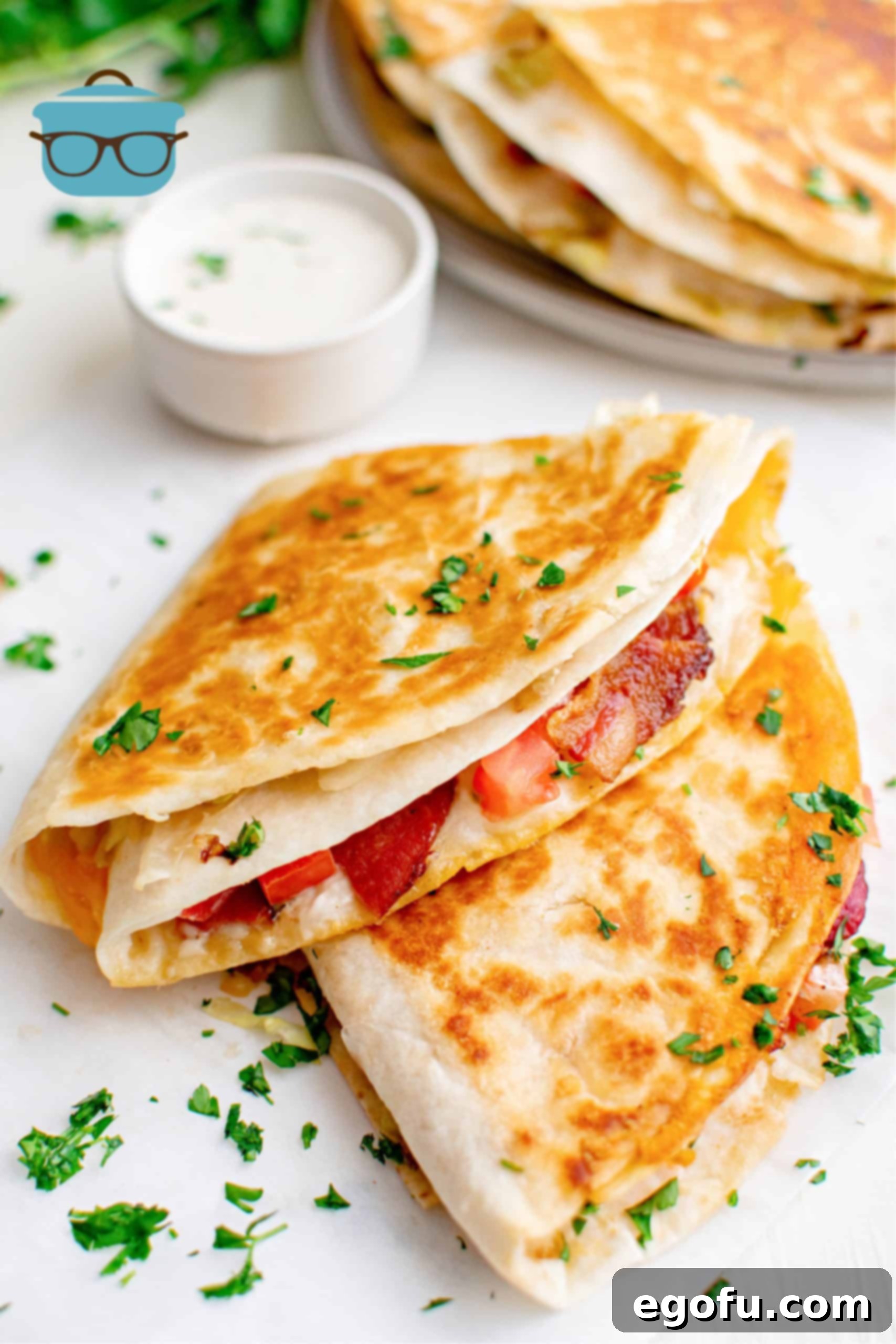 BLT Quesadillas stacked on top of one another, showcasing their crispy golden exterior and tempting layers.