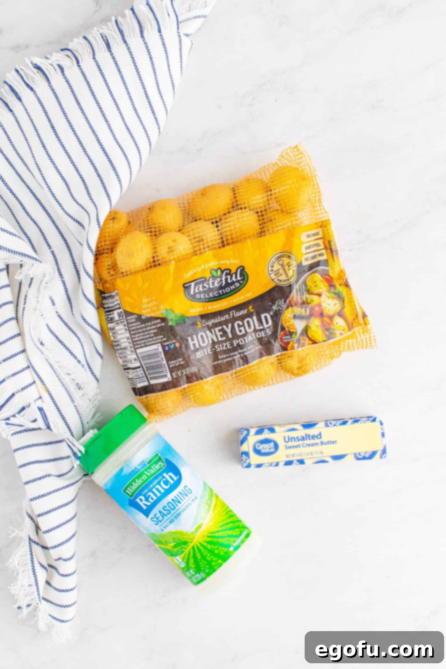 Ingredients needed to make Ranch Smashed Potatoes: baby potatoes, butter and ranch seasoning.