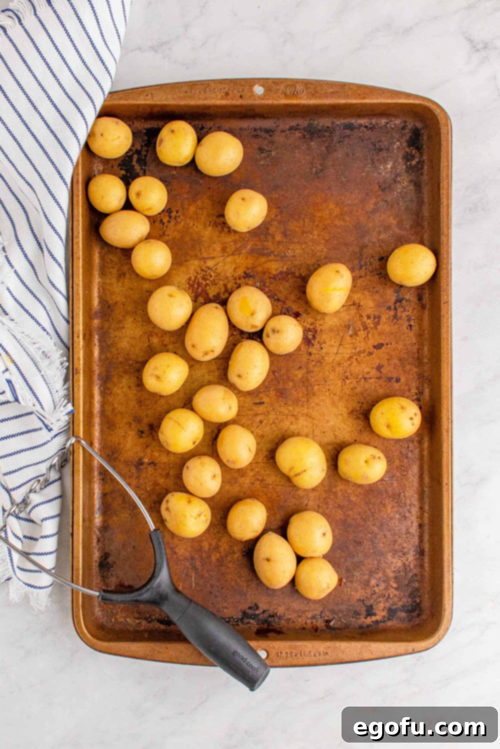 Potatoes on a copper sheet pan.