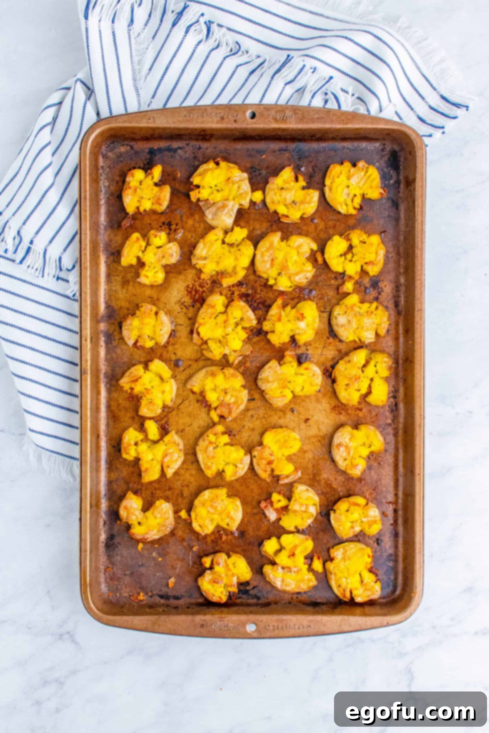 Overhead of finished Ranch Smashed Potatoes on baking sheet.