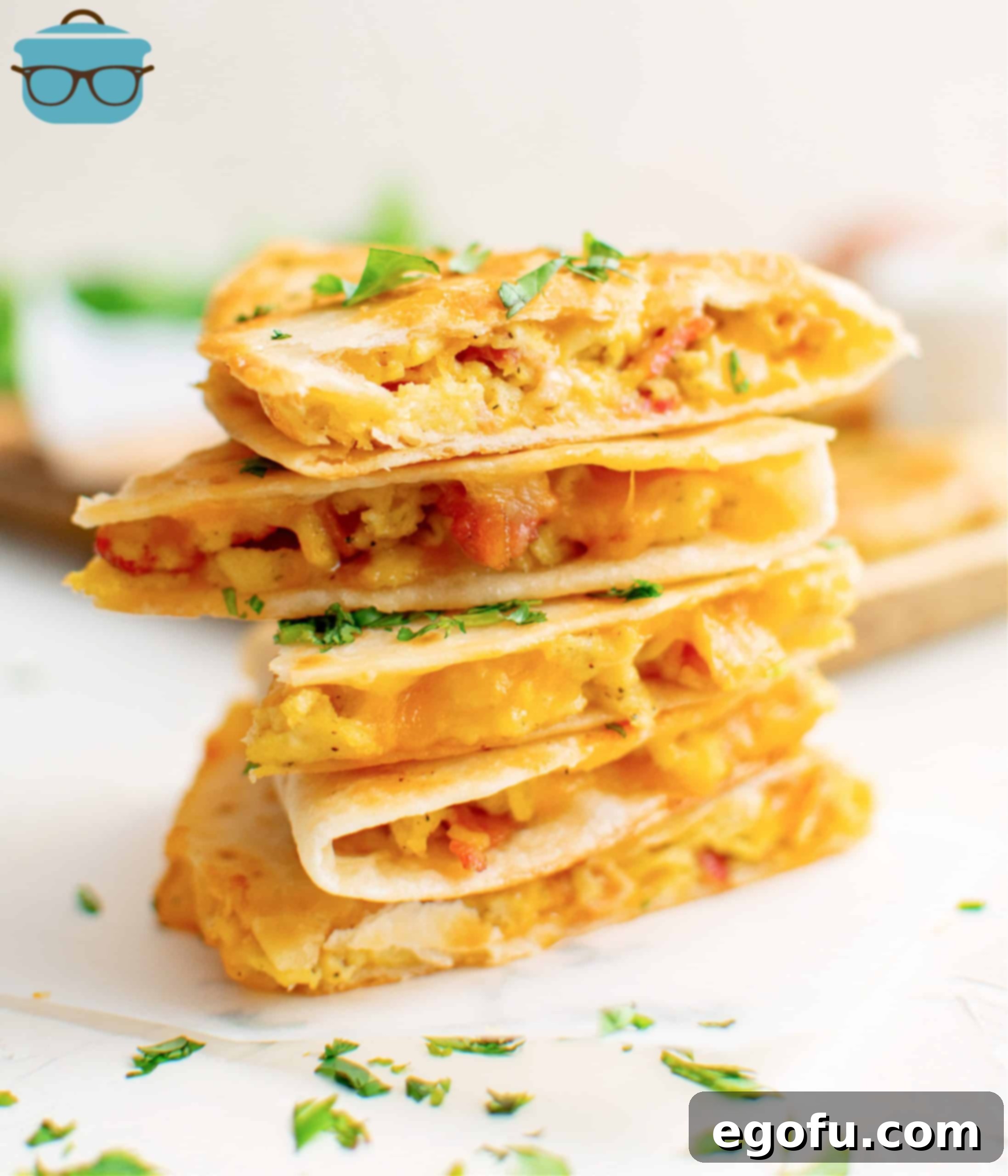 Breakfast Quesadillas cut in half and stacked in pile.
