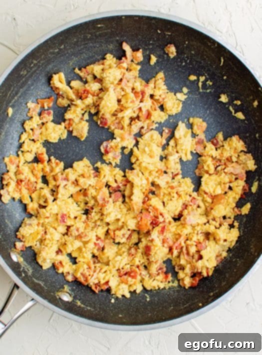 Bacon and eggs cooked in pan