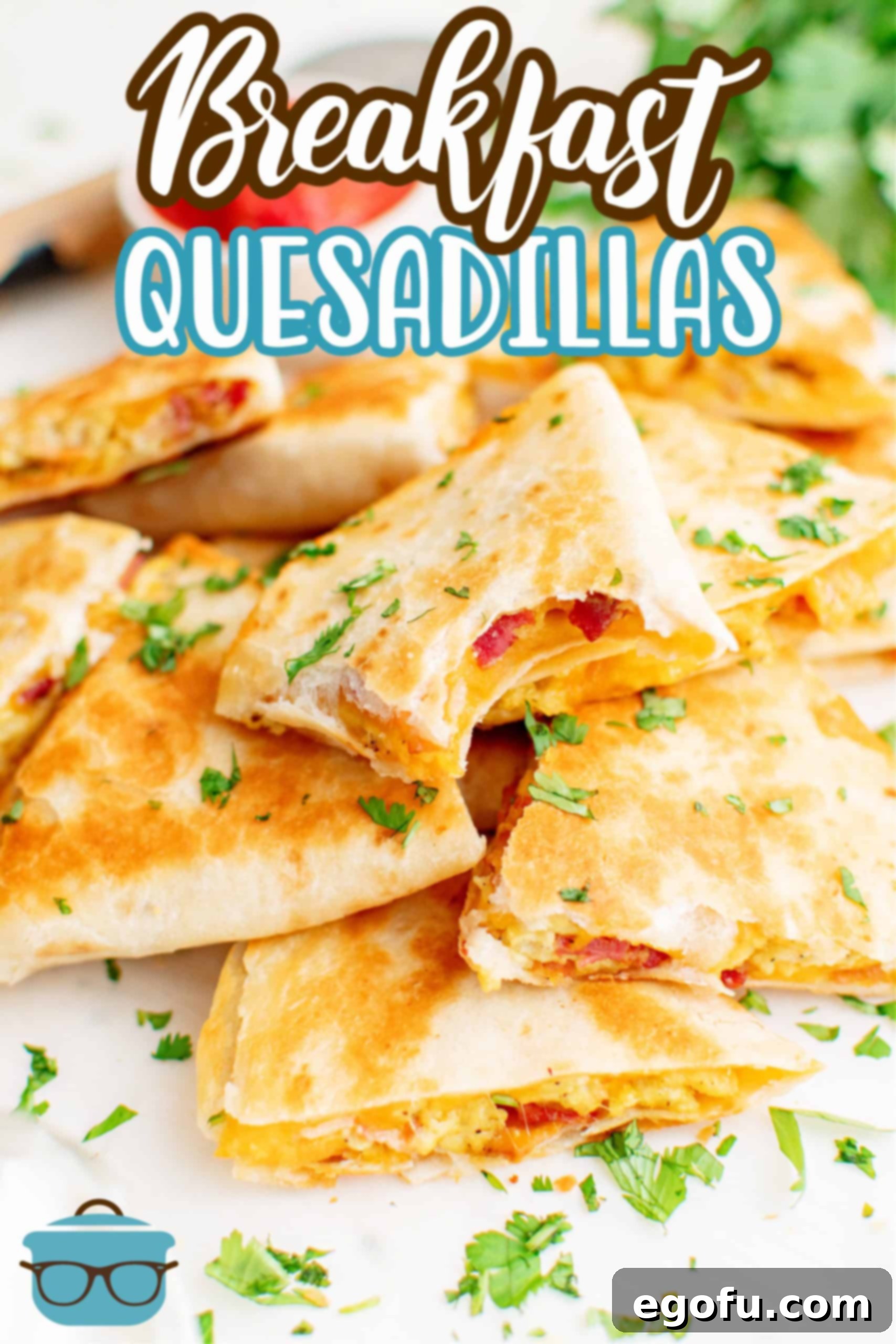 Breakfast Quesadillas in pile with bite taken out of one.