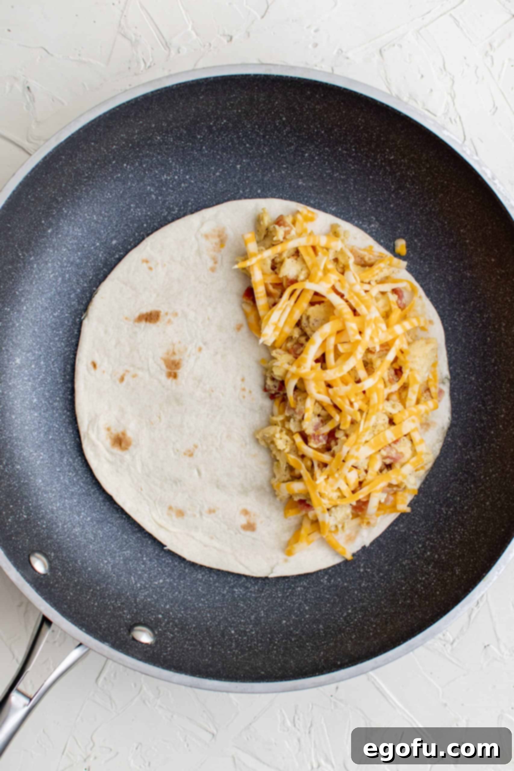 Cheese topped over egg and cheese mixture. 