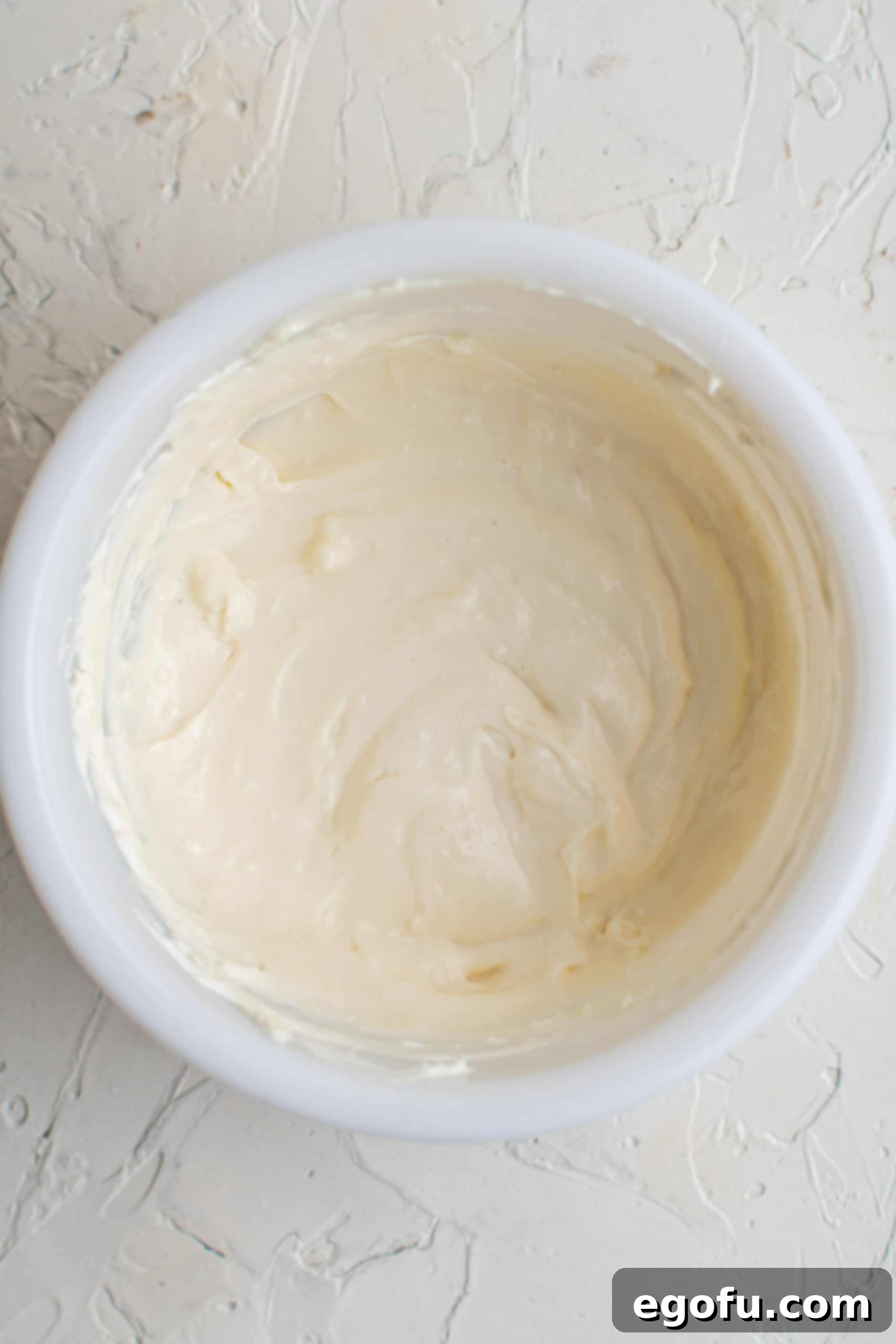 Whisked together sauce ingredients in bowl.