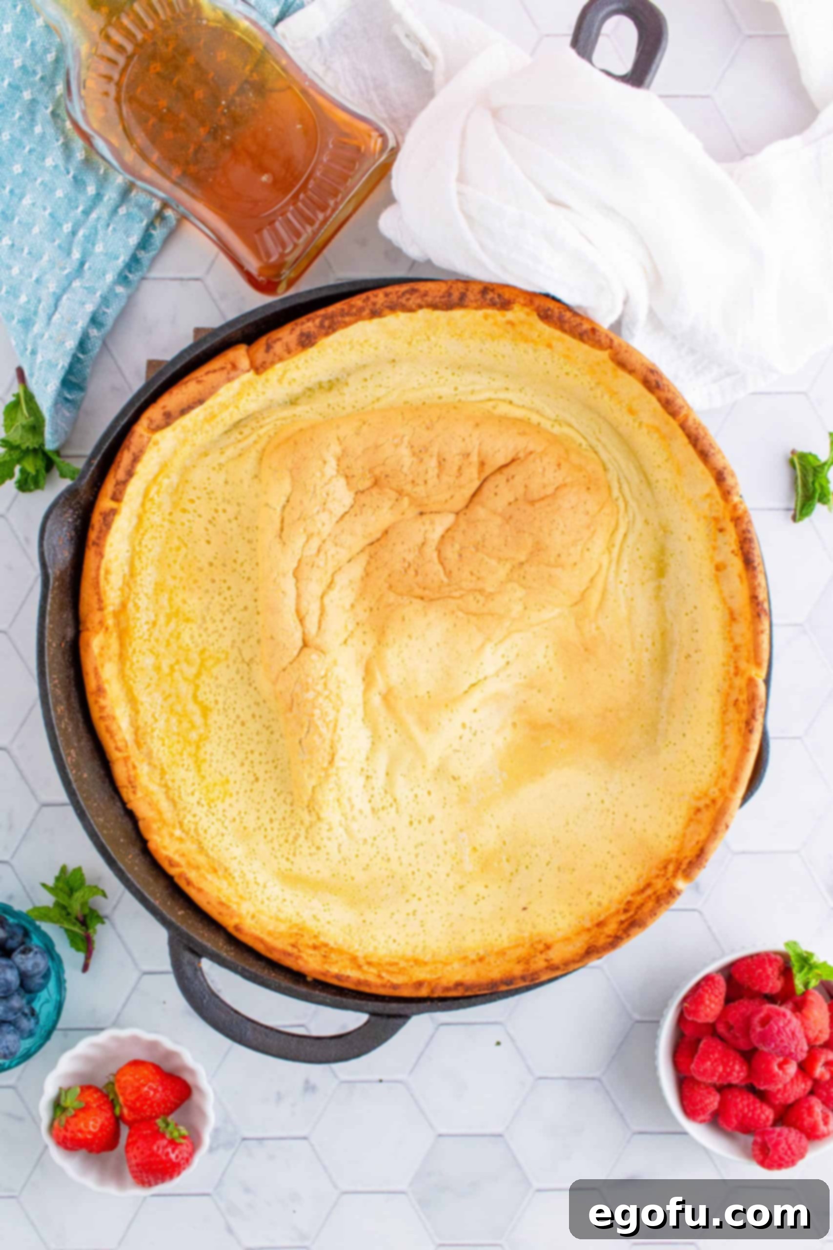 Oven Baked Cloud Pancake 7 fully baked Dutch Baby Pancake Recipe in skillet.
