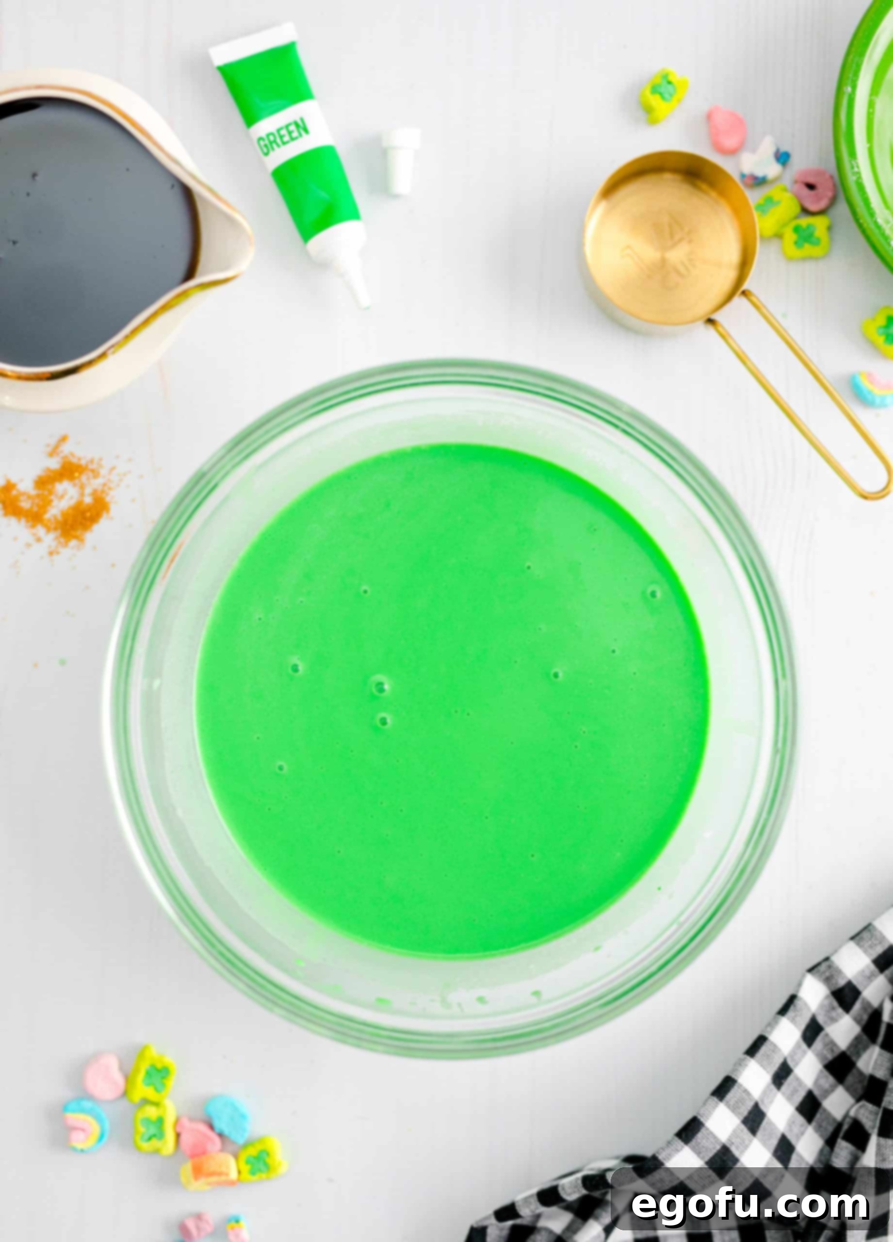 Smooth, bright green pancake batter in a bowl, showcasing the desired consistent color before combining with the dry ingredients.