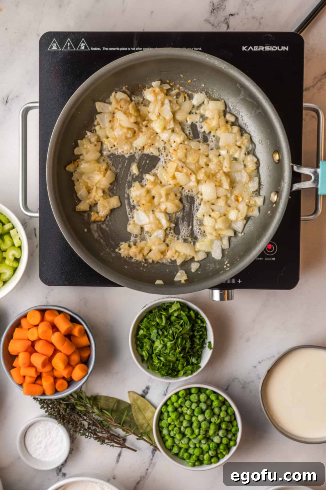 Flour stirred into onions in pan.