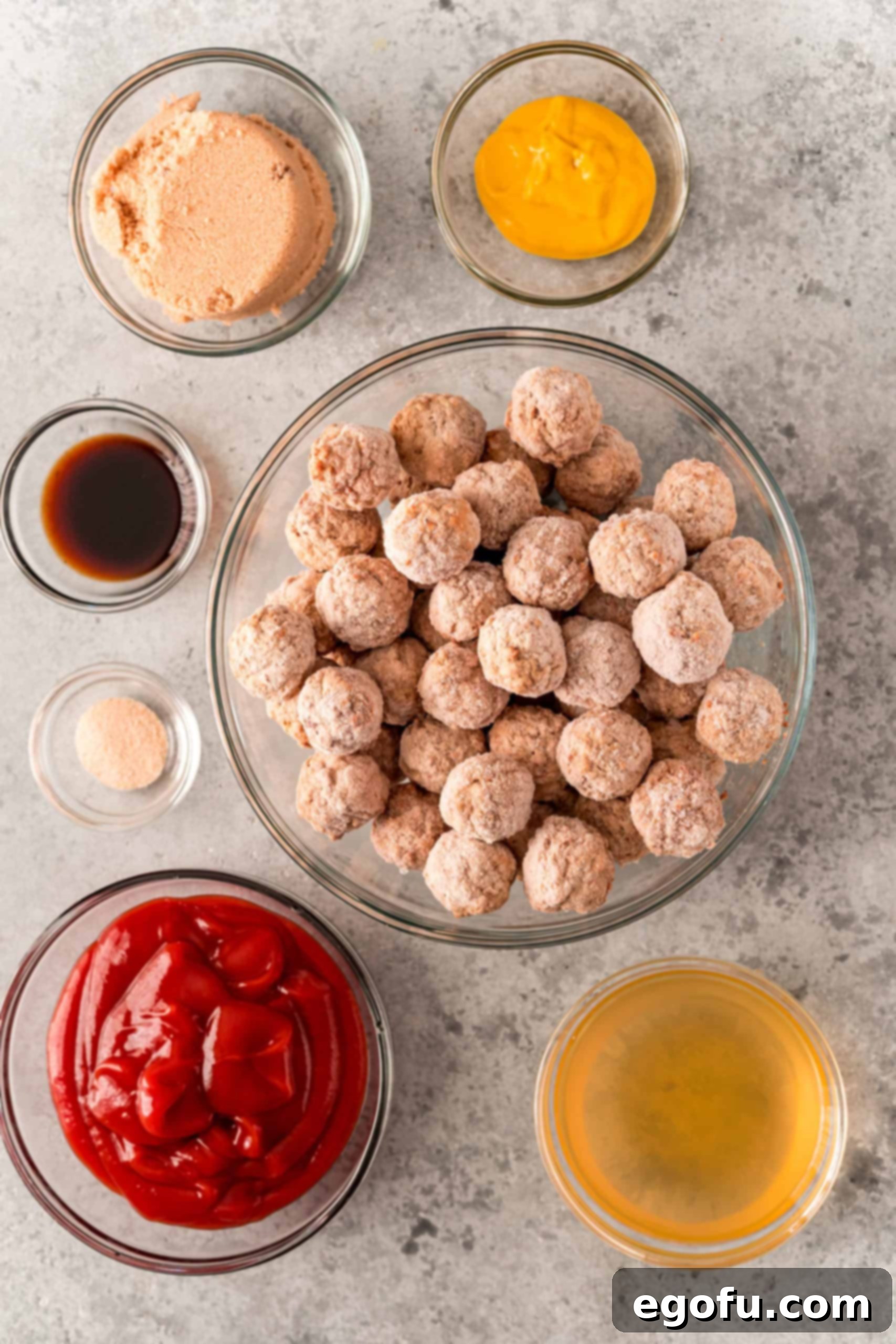Slow Cooker Meatloaf Bites 4 Ingredients needed to make Crock Pot Meatloaf Meatballs: frozen meatballs, ketchup, brown sugar, beef broth, mustard, Worcestershire sauce, and onion powder.