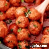 Slow Cooker Meatloaf Bites 8 Close up of Crock Pot Meatloaf Meatball Recipe with serving spoon in crock pot